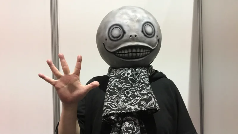 Director, Yoko Taro, hiding his face