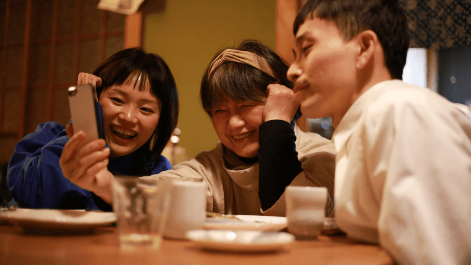 japanese family sitting around a kotatsu